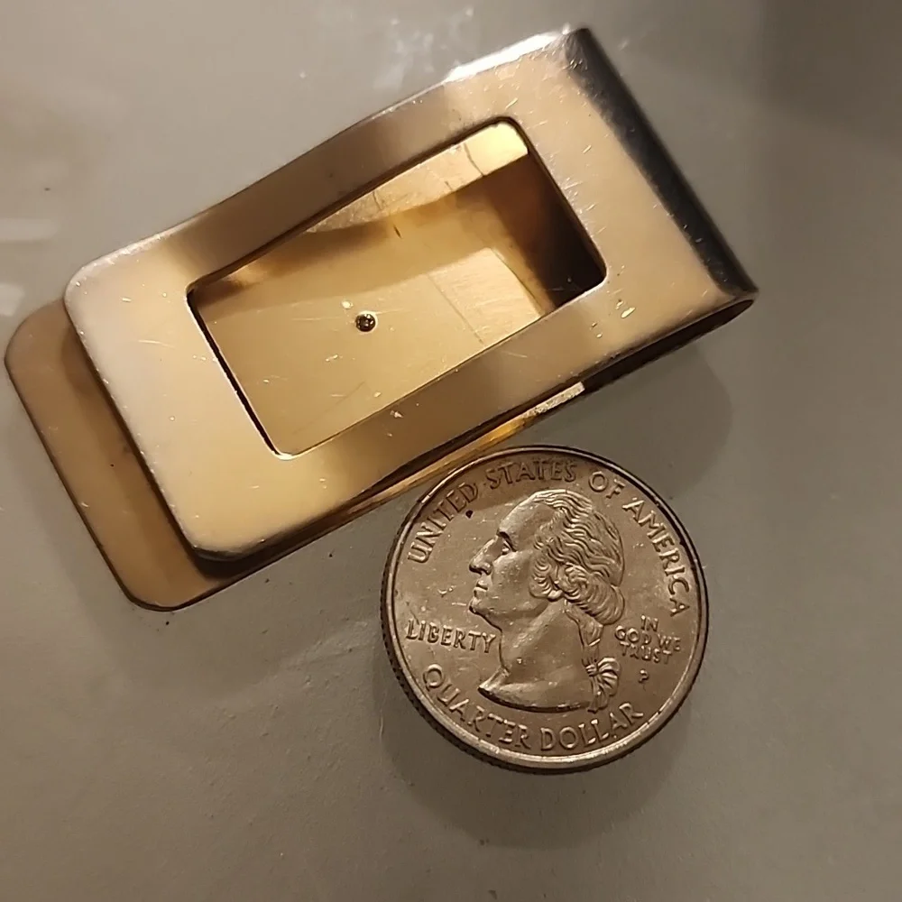 Goldtone  Money Clip With A Diamond Like Stone.